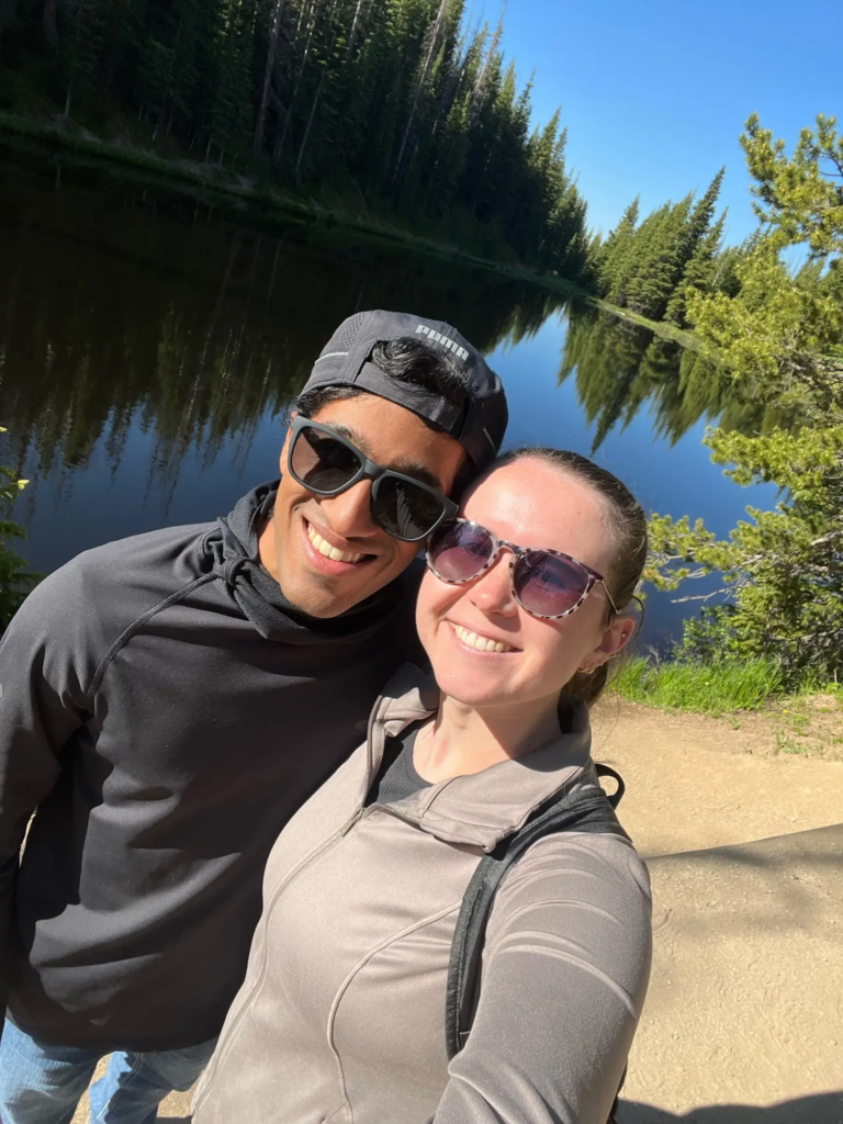 Dietitian Olivia posing with boyfriend by a lake in Colorado