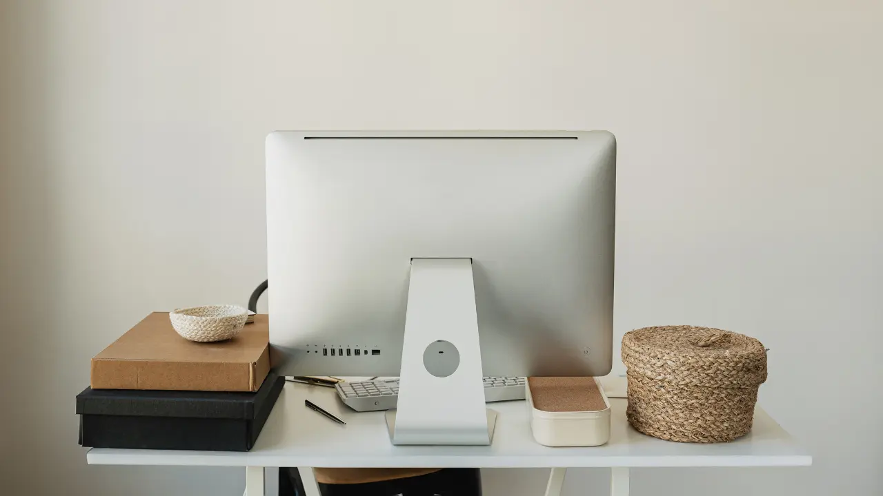 A monitor on a clinician's desk, with blog post open covering the best SEO Tools for Weight-Inclusive Private Practices