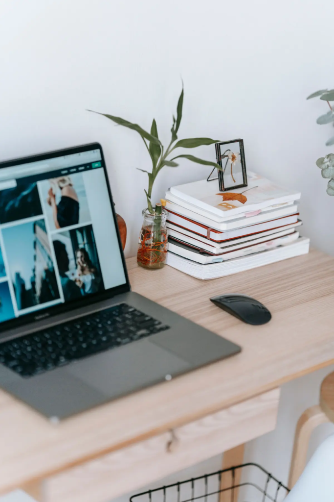 A laptop open with stock images pulled up for a dietitian website