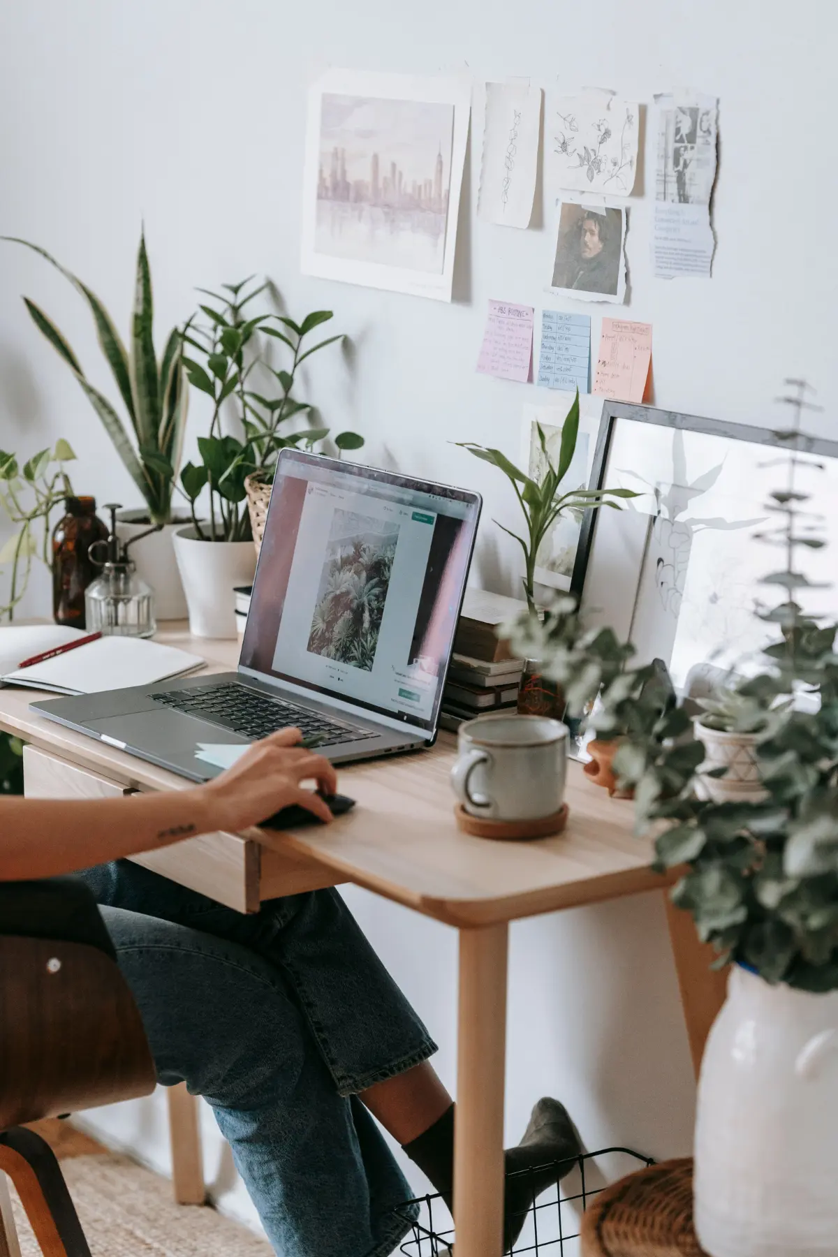 A weight-inclusive dietitian working at her laptop to update her website